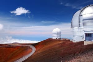 Observatories on top of Mauna Kea mountain peak. Astronomical research facilities and large telescope observatories located at the summit of Mauna Kea on the Big Island of Hawaii United States