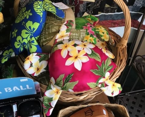 Basket of homemade Hawaiian plush sea turtles