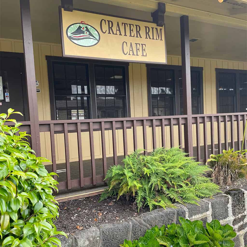 Outside of Crater Rim Cafe showing the signage and plants outside