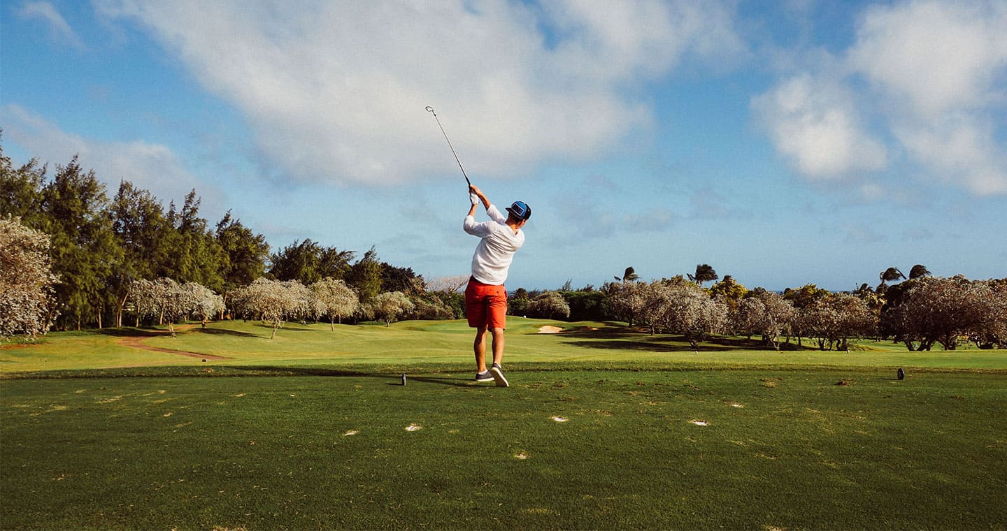 A man just hit a golf ball with his club