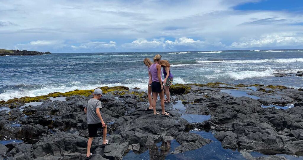 Kids at the Black Sand Beach looking for Turtles