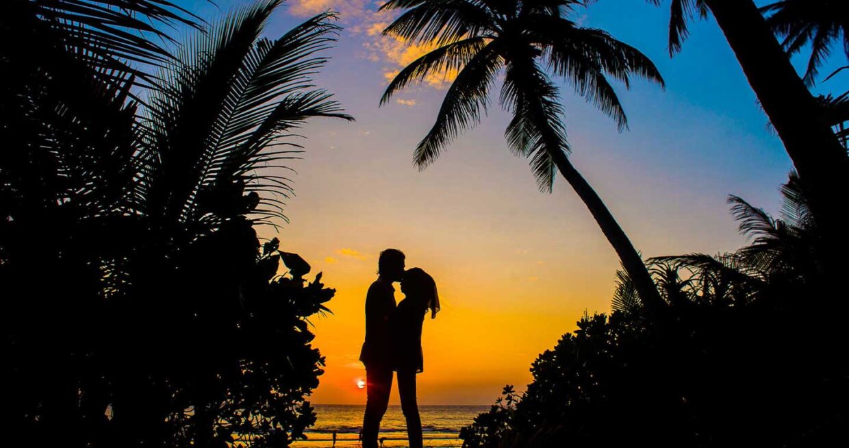 silhouette of a sweet couple over the sunset