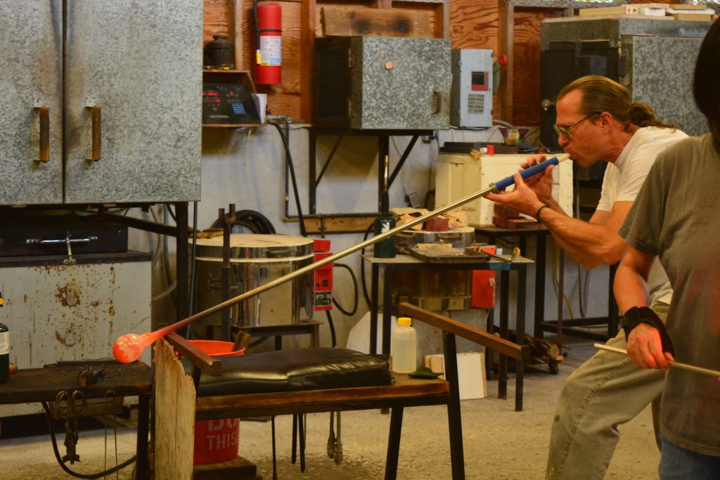 Glass artists, Michael and Misato Mortara working in their studio, 2400 Fahrenheit