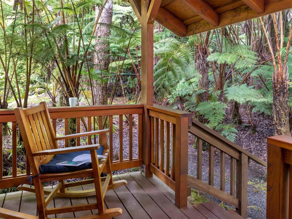 Hale Manaluna Porch with Rocking Chair and green vegetation all around