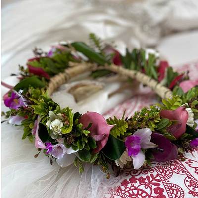 A sweet-smelling Floral Haku Lei woven with a variety of tropical and seasonal flowers and foliage
