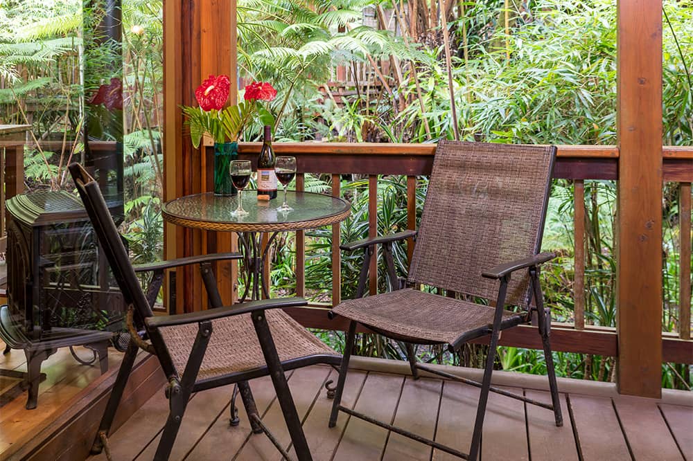 Porch with two chairs and table at Mauna Loa