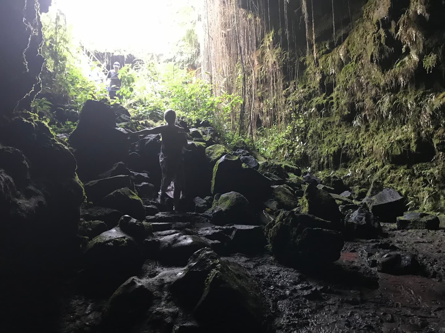 A hiker in the Kaumana Caves on the Big Island